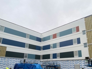 Red Fish Healing Centre siding under construction
