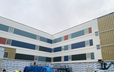 Red Fish Healing Centre siding under construction